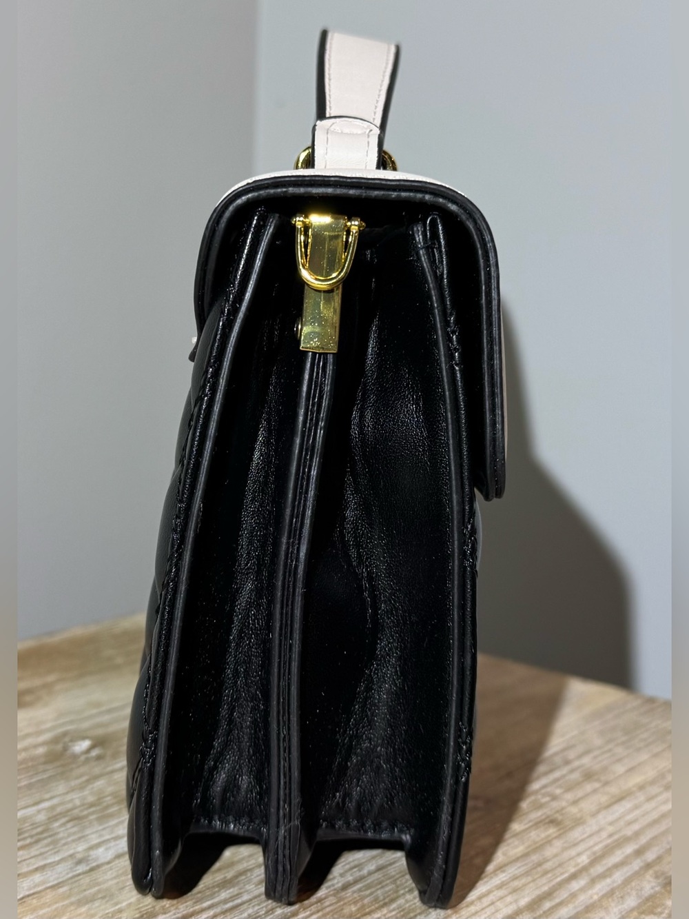 White and Black Quilted Top-Handle Bag with Gold Emblem - Picture 3 of 11